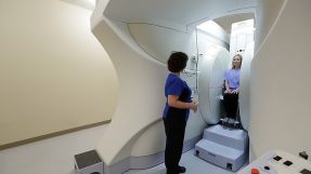 Patient in Open Upright Imaging machine